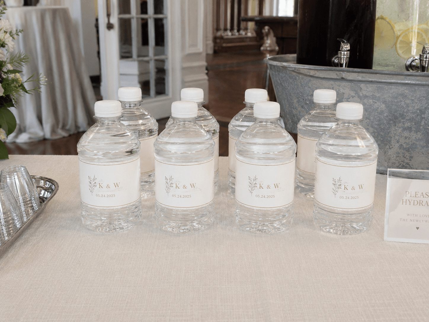 K & W monogrammed wedding bottles on the reception table